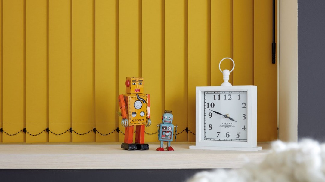 Closed vertical blinds in kids bedroom